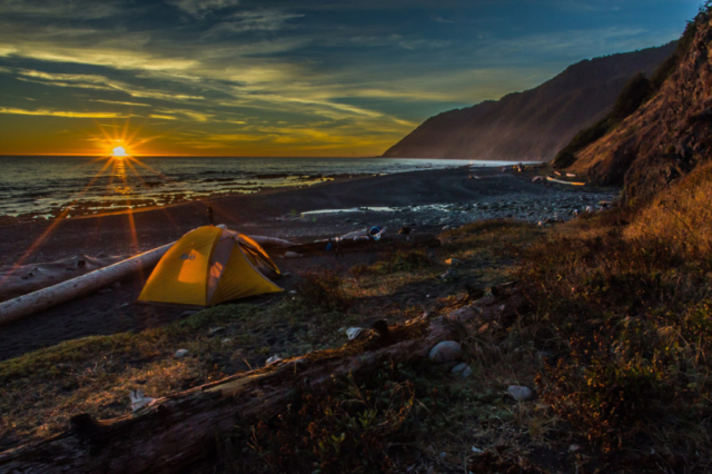 Tent in the seashore during sunset on Lost Coast Trail